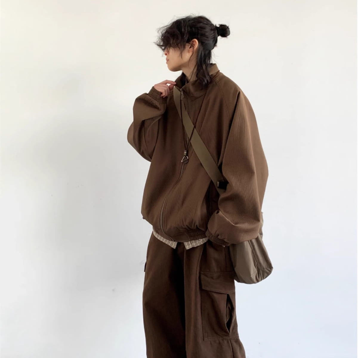 brown corduroy bomber jacket with a relaxed fit and zipper front designed as retro loose zipper outerwear.