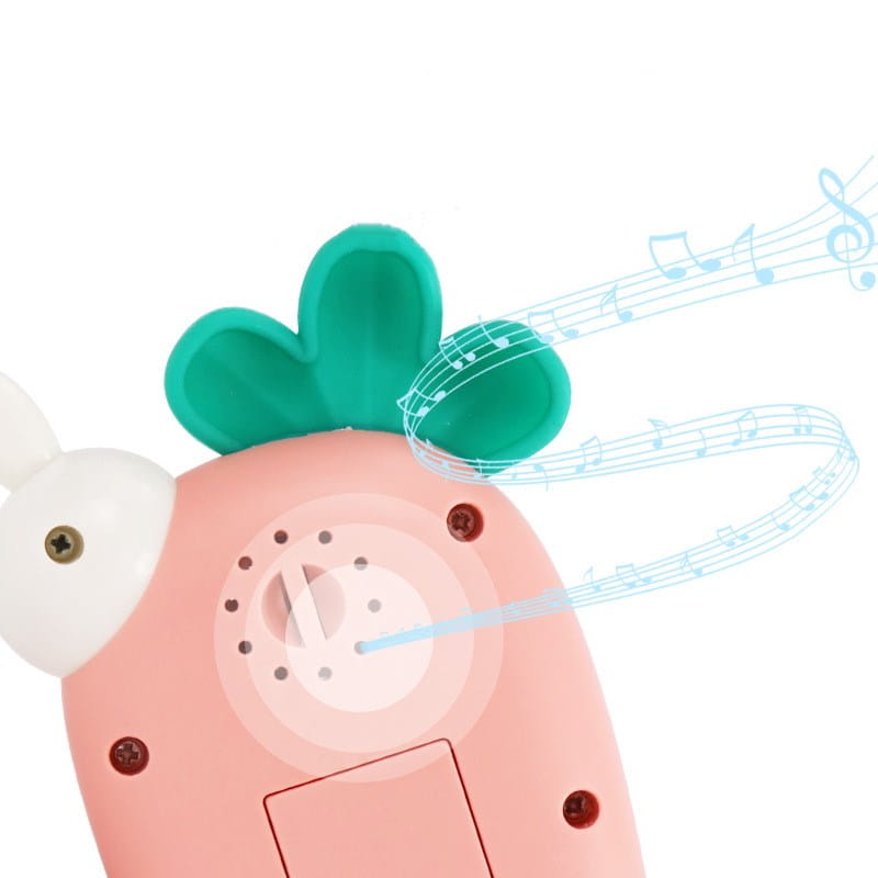 pink plastic baby toy phone shaped like a carrot with a green leafy top and white ear designed as an educational music toy