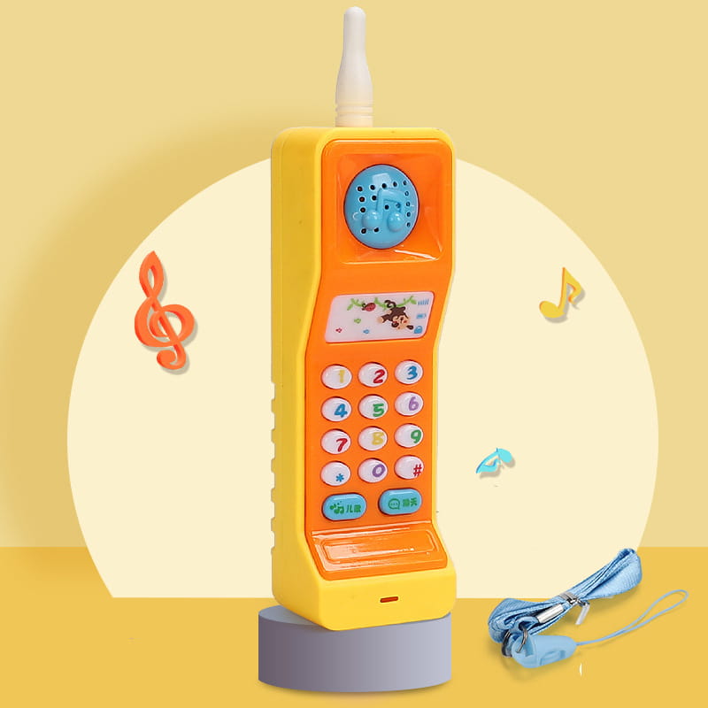 Bright orange plastic baby toy phone carrot shape educational music toy with blue speaker, colorful number keypad, and cartoon character display.