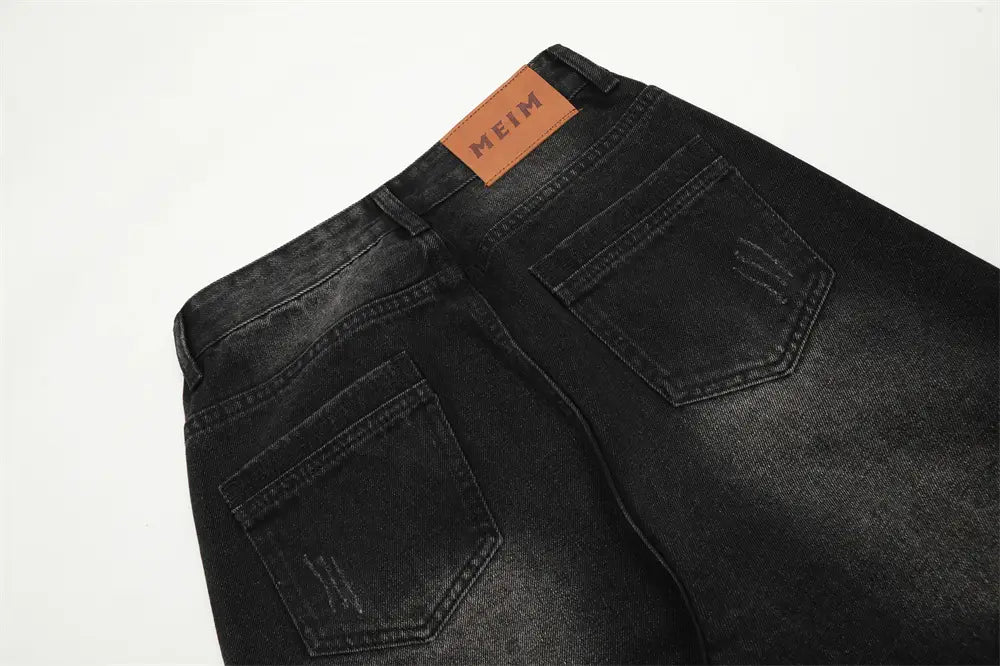 Vaqueros negros de mezclilla con pernera recta y estilo desgastado para hombre