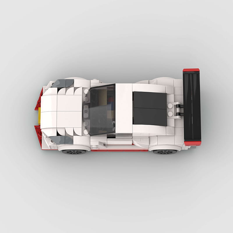 White and red lego nismo r35 racing car model with black accents made of 251 building blocks for toy construction.