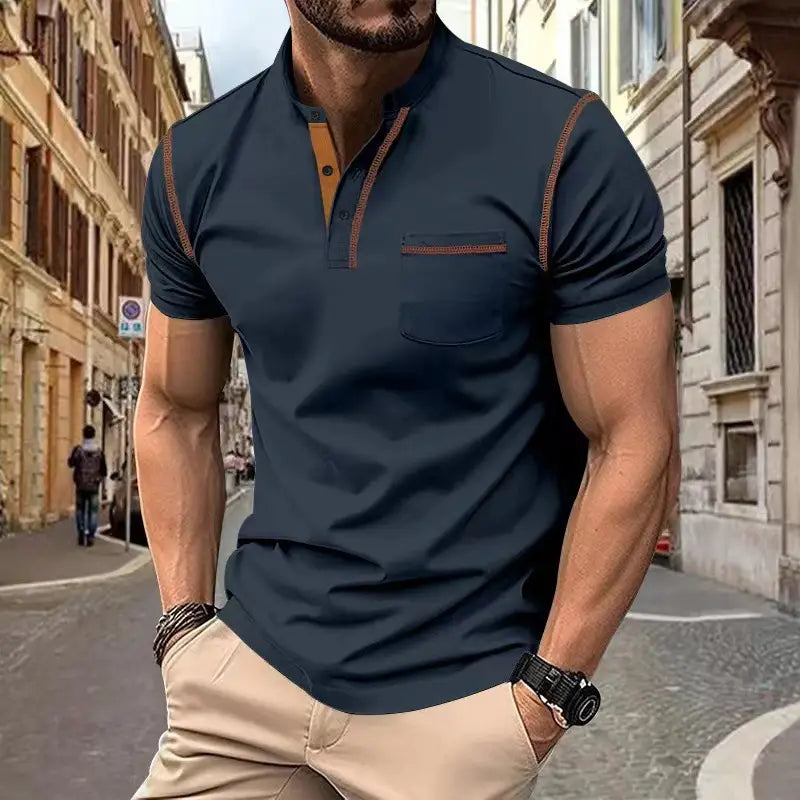 Men’s slim fit dark navy short-sleeved polo shirt with contrasting tan trim along the collar placket and sleeve seams.