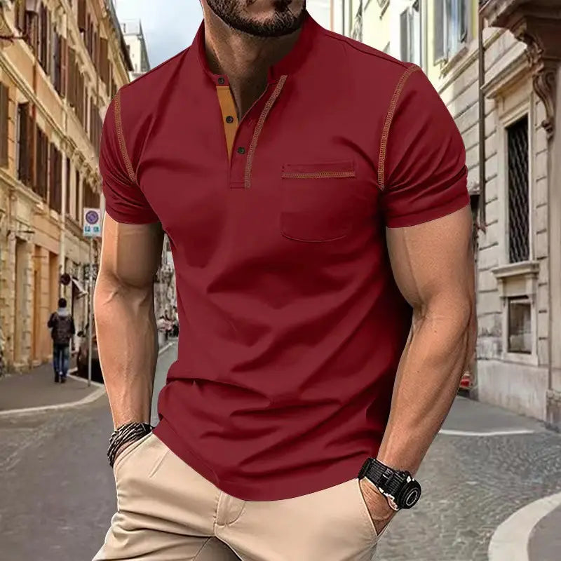 A men’s slim fit short sleeve polo shirt in rich maroon with contrasting tan accents on the collar placket and pocket trim.