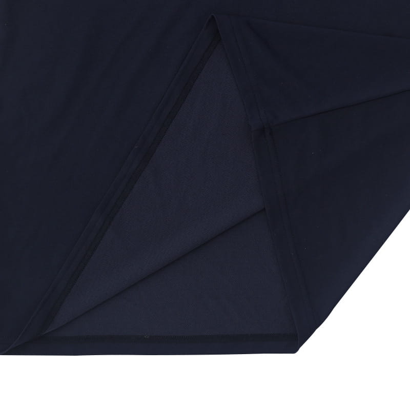 Dark navy fabric with a smooth slightly textured surface and clean stitched seams on a men’s slim fit short sleeve Henley and polo shirt.
