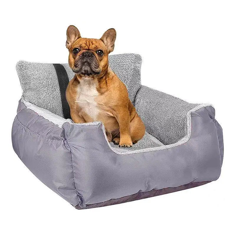 Plush dog car seat for small pets in gray with a soft textured interior and white trim made of gray plush material.