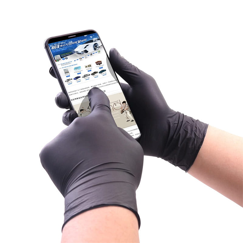 black nitrile disposable protective gloves 100 pack shown worn on hands holding a smartphone