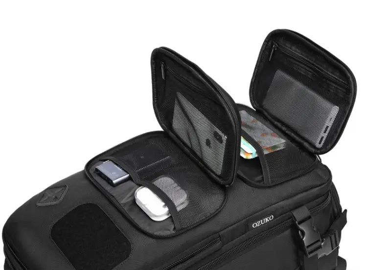 Black ozuko travel organizer with mesh compartments and zippered sections inside tactical waterproof laptop backpack with waist bag for storing small electronics and accessories.