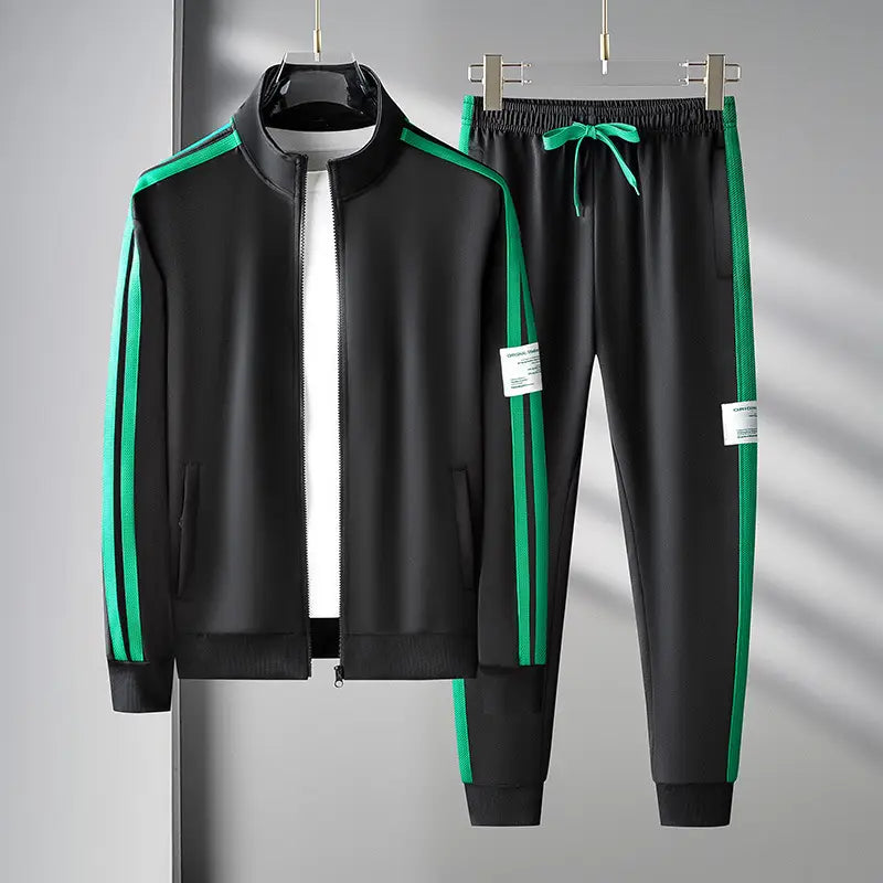 Men track suit zip two piece set green featuring a black athletic tracksuit with vibrant green side stripes and a matching drawstring waistband.