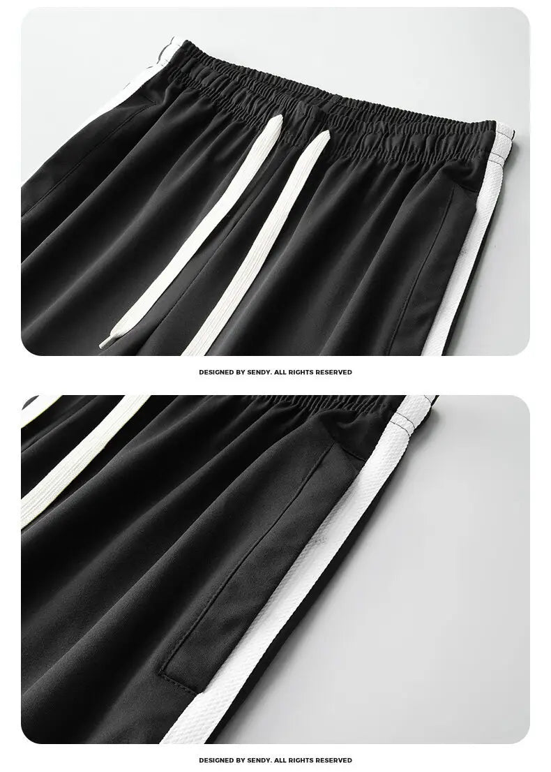 Black athletic pants with white side stripes and a drawstring waistband from the men track suit zip two piece set green designed for sports and casual wear.