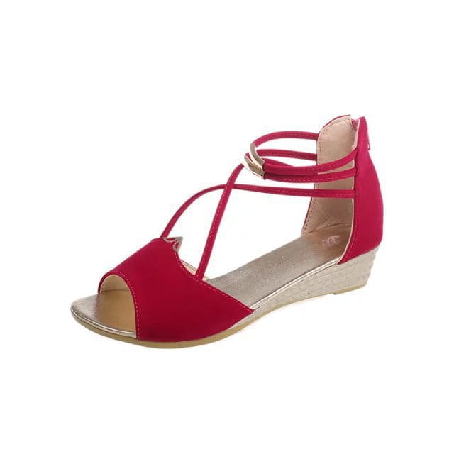 Red suede wedge sandal with crisscross straps and a metallic buckle from the suede wedge sandals Korean low heel strappy shoes collection.