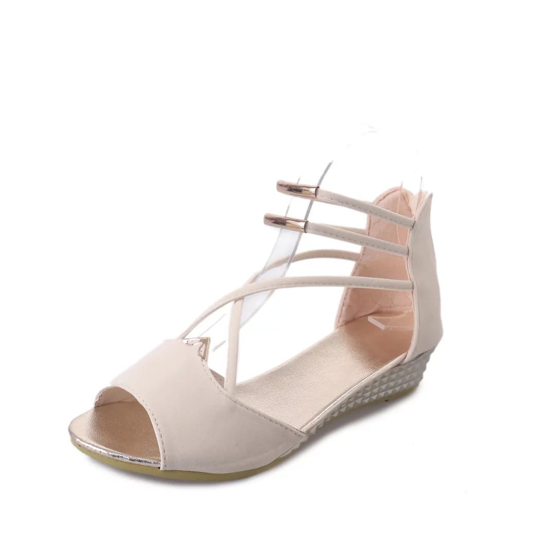 Beige suede wedge sandal with metallic accents and a textured sole featuring a Korean low heel and strappy design.