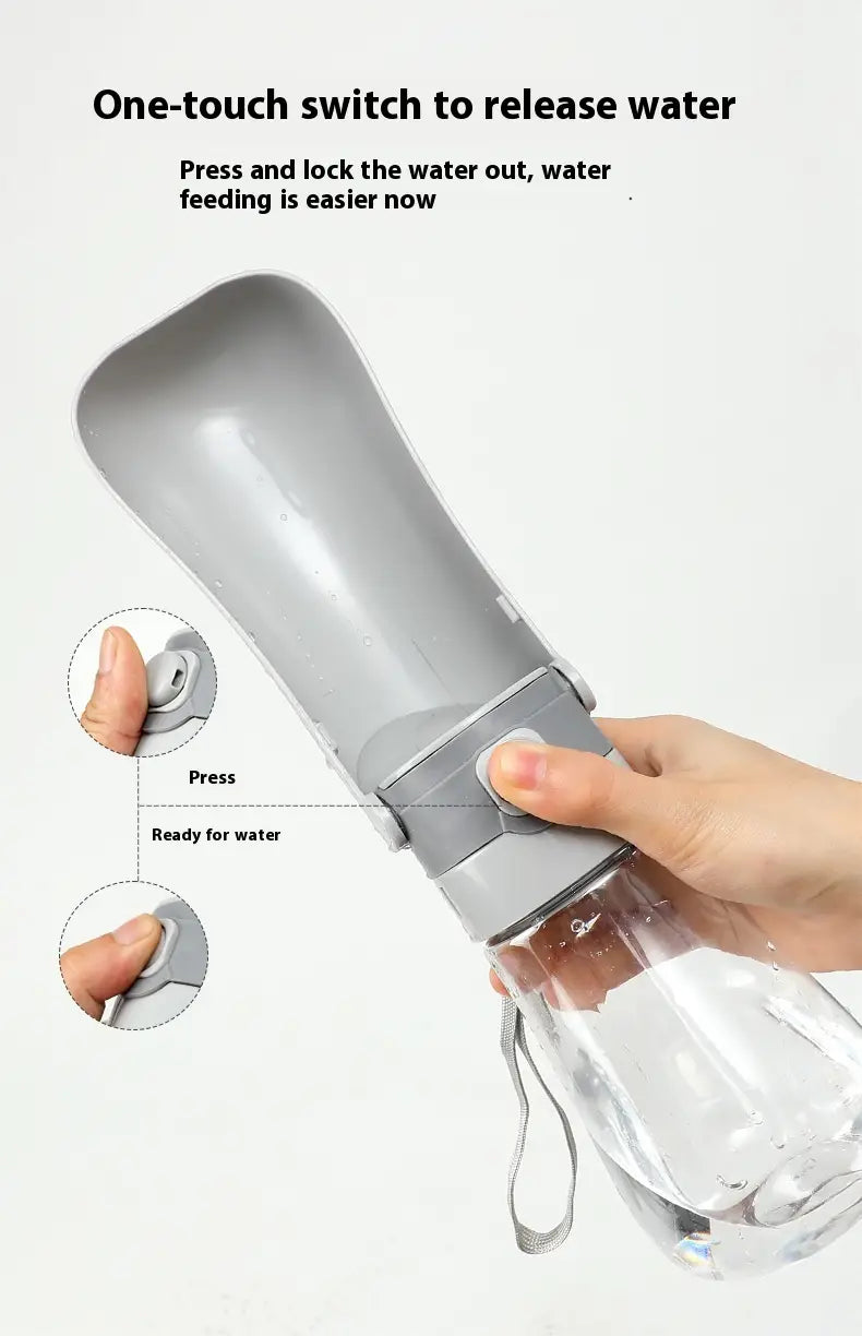 Gray plastic portable pet water bottle with carbon filter featuring a one-touch release mechanism and clear transparent base.
