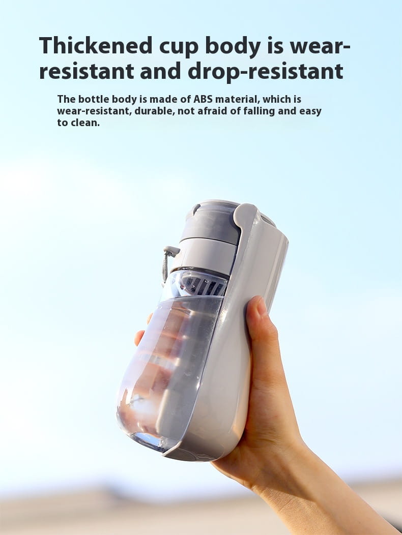 Gray and transparent portable pet water bottle with carbon filter featuring a thickened wear-resistant ABS plastic body.