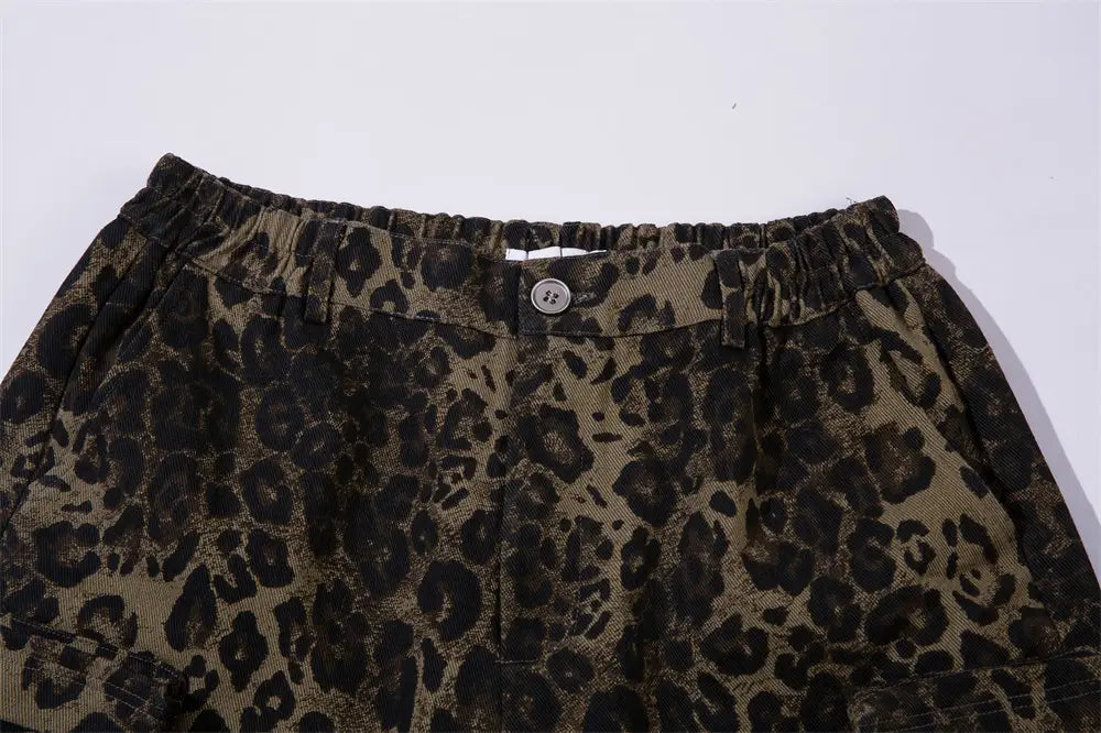 Men’s leopard print denim and cargo workwear shorts in brown and black with an elastic waistband.