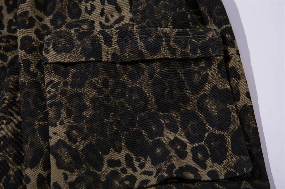 A close-up of a leopard print pocket on dark brown corduroy fabric from men’s leopard print denim and cargo workwear shorts.