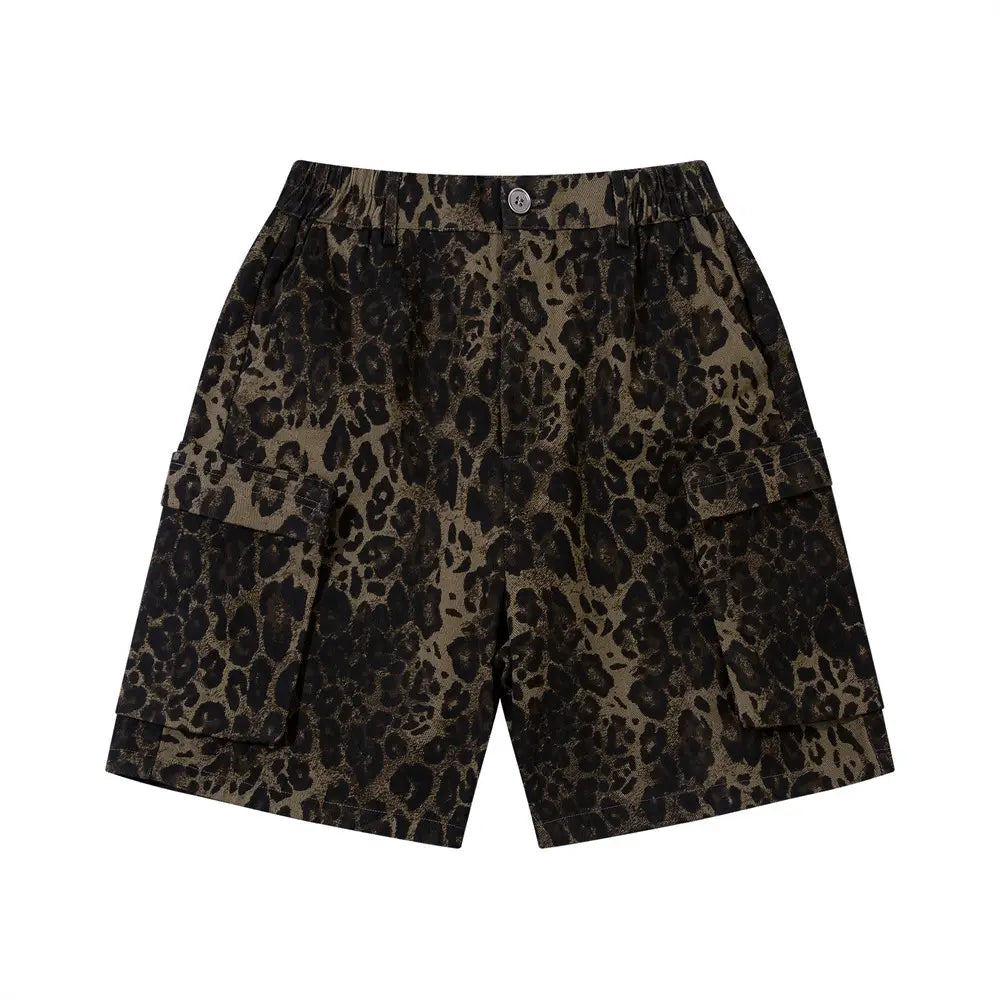 Men’s leopard print denim and cargo workwear shorts featuring a bold black and olive green leopard print pattern with an elastic waistband and flap pockets.