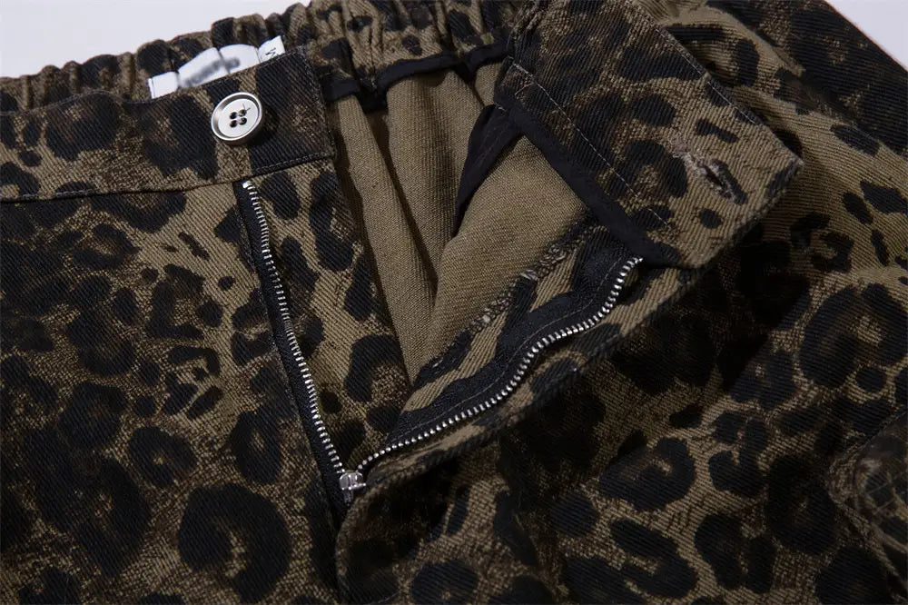 Men’s leopard print denim and cargo workwear shorts featuring brown and black leopard-print corduroy fabric with a button closure.
