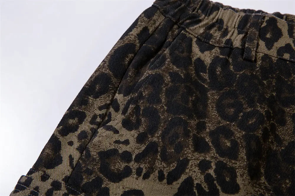 Men’s leopard print denim and cargo workwear shorts featuring dark brown and black corduroy pants material pattern.