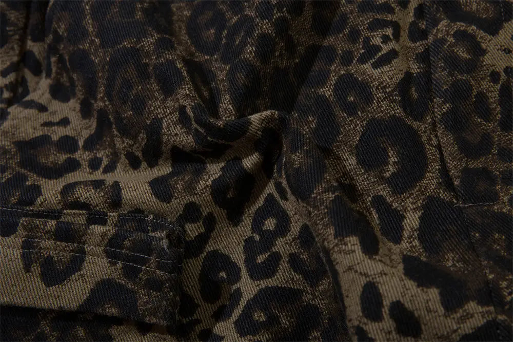 Men’s leopard print denim and cargo workwear shorts featuring dark brown and black leopard-print denim fabric with a textured, slightly worn appearance.