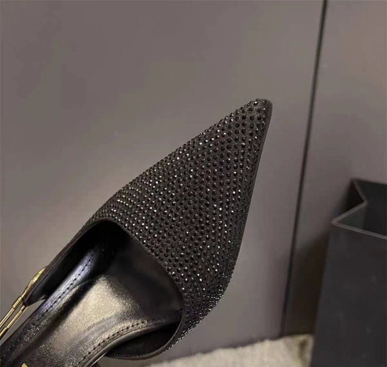 Black rhinestone slingback stiletto heel with a pointed toe covered in sparkling rhinestones.