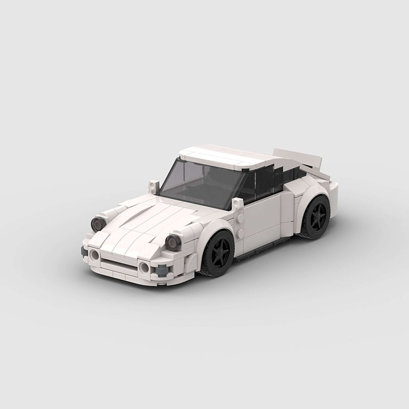 White lego Porsche 911 sports car building block model with black wheels and transparent windows.