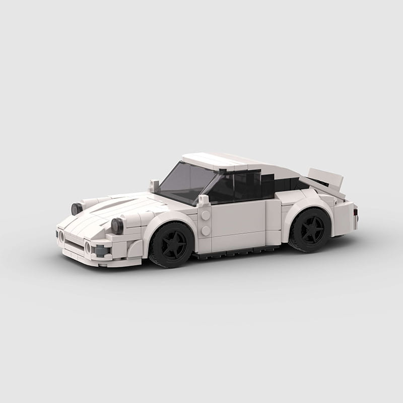 white lego-built Porsche 911 sports car model with black wheels and a sleek aerodynamic design