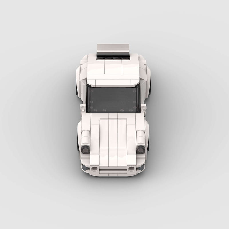 White lego Porsche 911 sports car building block model with black tinted windows and detailed paneling.