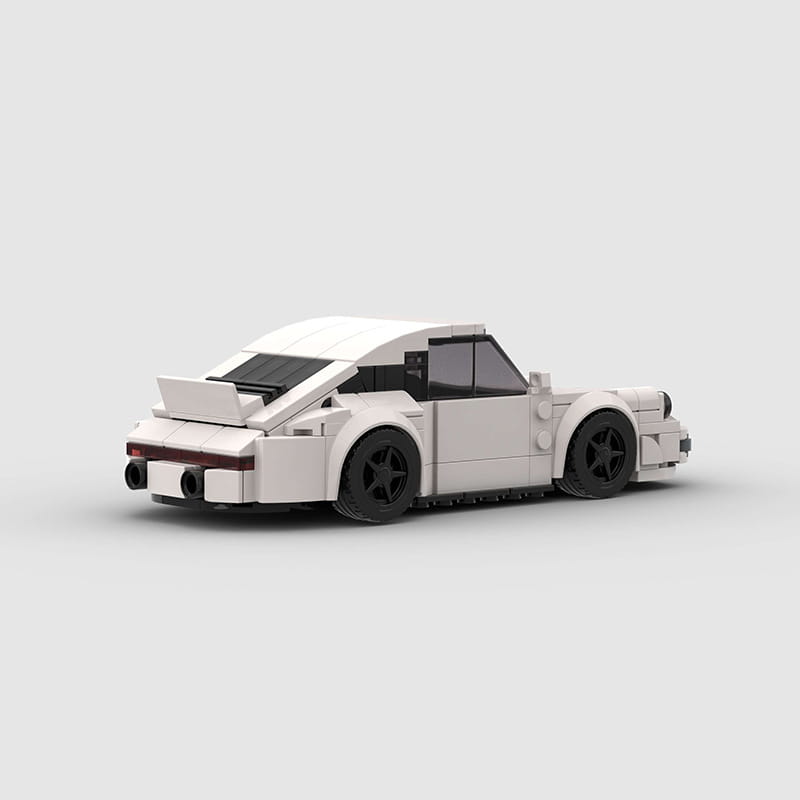 White Lego Porsche 911 sports car building block model showing the back side with black wheels and red taillights.