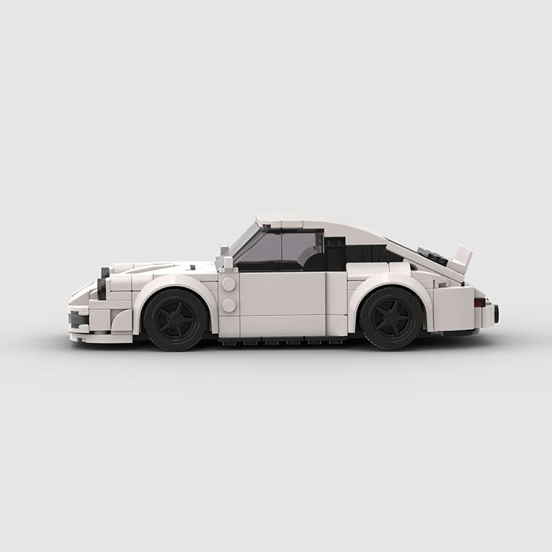 A white Lego Porsche 911 sports car building block model with black wheels and windows shown from the back side.