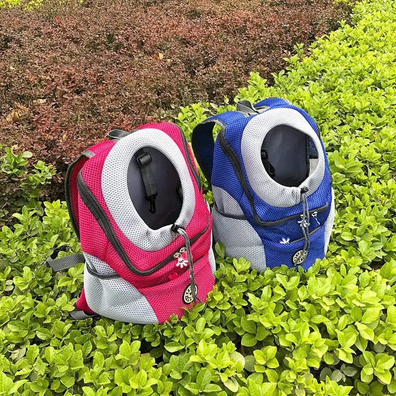 Breathable mesh pet carrier backpacks for travel in pink and blue with white accents designed for comfort and ventilation.