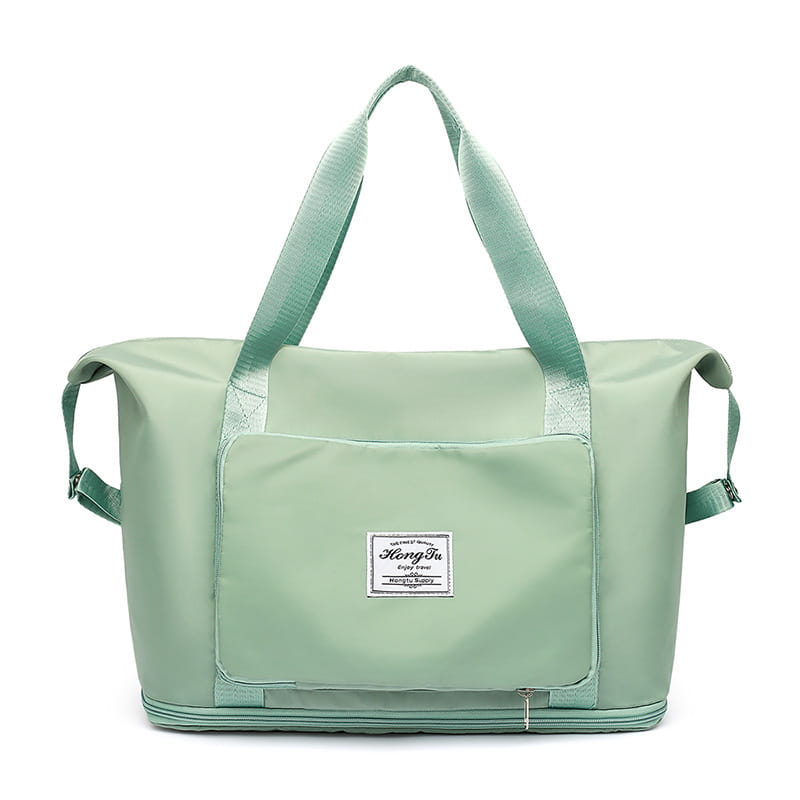 Light green durable nylon foldable gym bag waterproof travel duffel with reinforced handles a front patch pocket featuring the hong ba brand label and a shoe pocket.