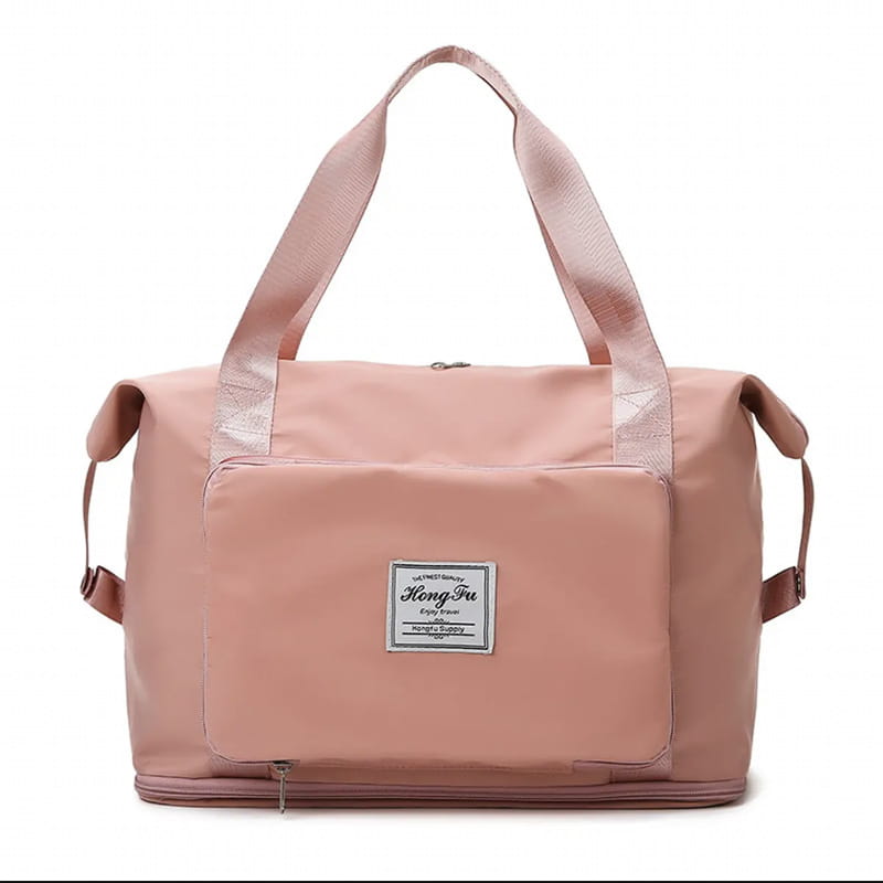 A soft pink lightweight foldable gym bag made of waterproof material featuring reinforced handles and a front patch pocket with the hong fu brand logo ideal for travel and shoe storage.
