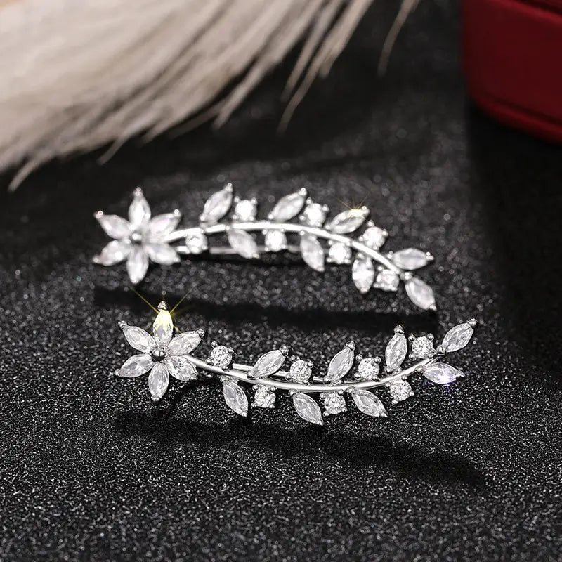 Crystal floral vine ear climber earrings for women featuring silver leaf and flower design adorned with clear crystals.