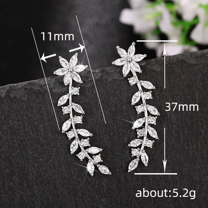 Silver floral vine ear climber earrings for women adorned with sparkling clear crystals.