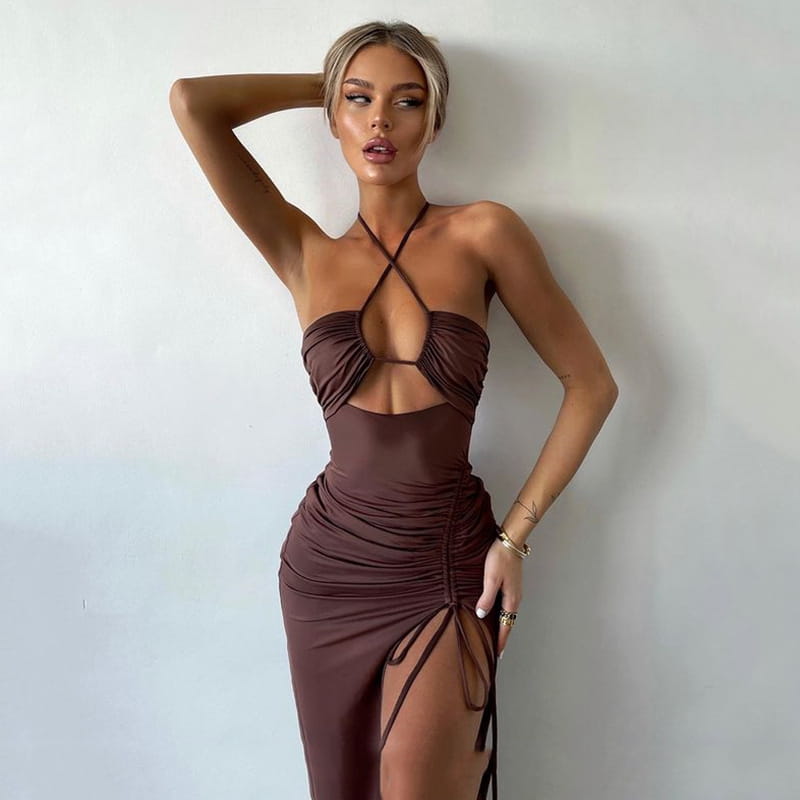 A form-fitting chocolate brown ruched halterneck satin maxi dress with a plunging neckline and side tie details.