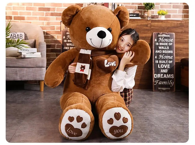 A plush brown teddy bear soft stuffed animal doll 60-100cm with white paw pads featuring heart designs and the words love and you holding a small bottle-shaped accessory.