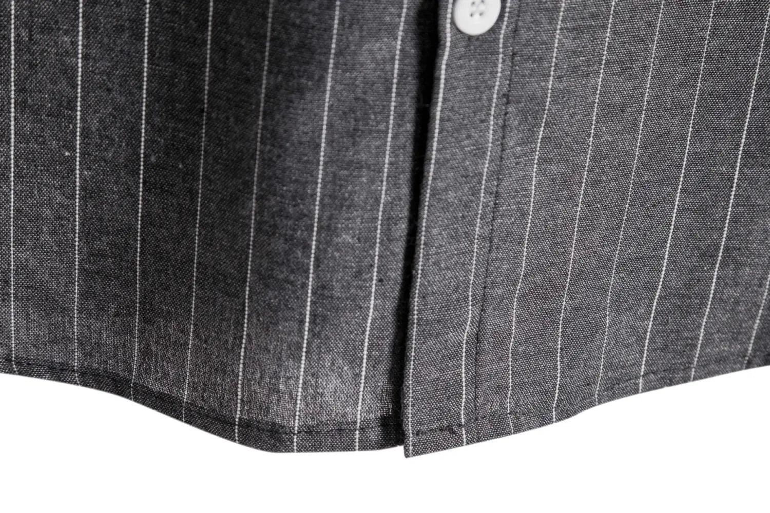 Men’s slim fit pinstripe short sleeve button up shirt in dark gray with fine white vertical stripes and a single white button at the collar.