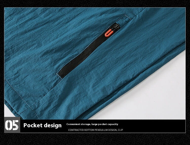 men’s ultrathin sun protective sports jacket shown with teal fabric pants featuring a zippered pocket with an orange zipper pull and black trim