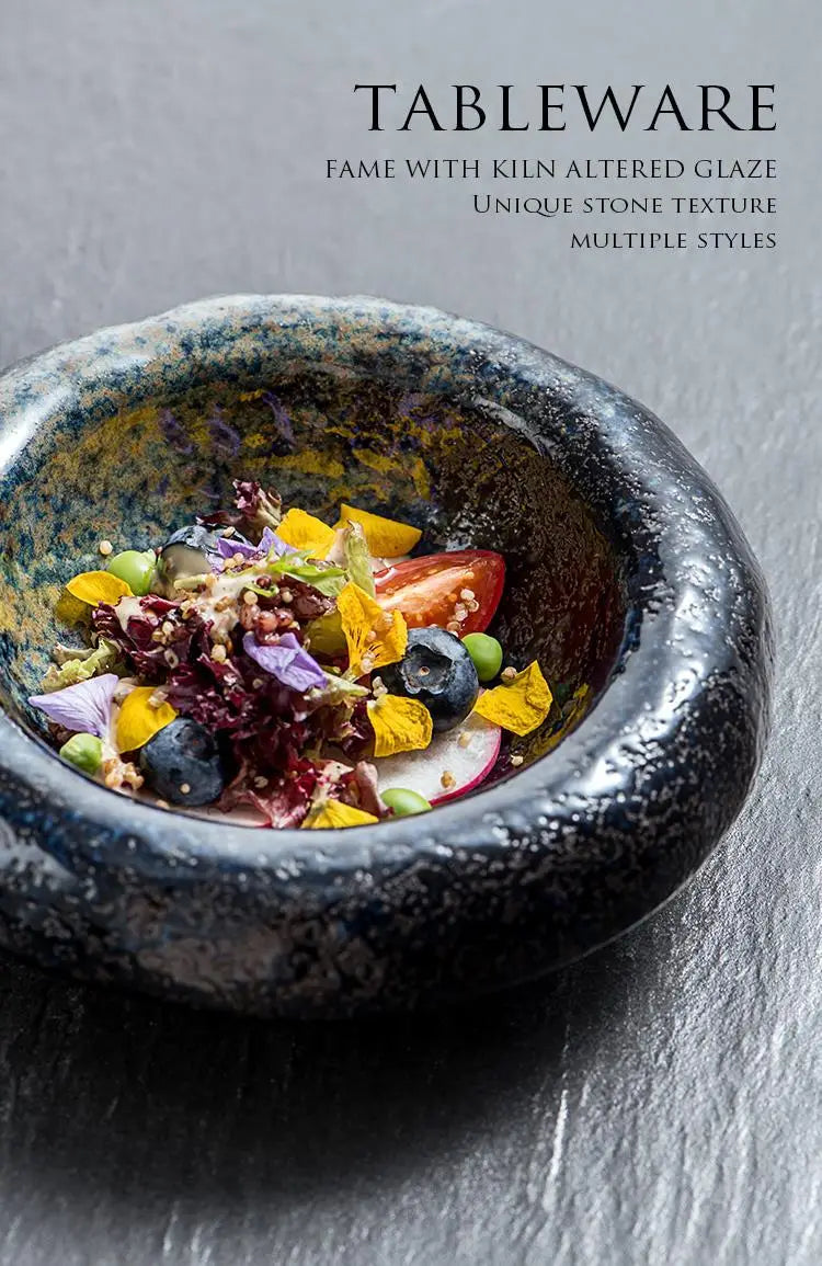A rustic dark blue ceramic sashimi bowl with a textured stone-like glaze and irregular rim ideal for serving sashimi.