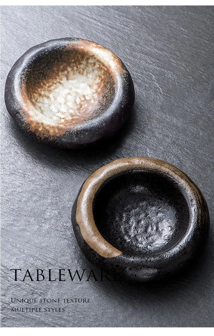Two rustic ceramic sashimi bowls with a dark speckled glaze and earthy brown accents ideal for serving sashimi.