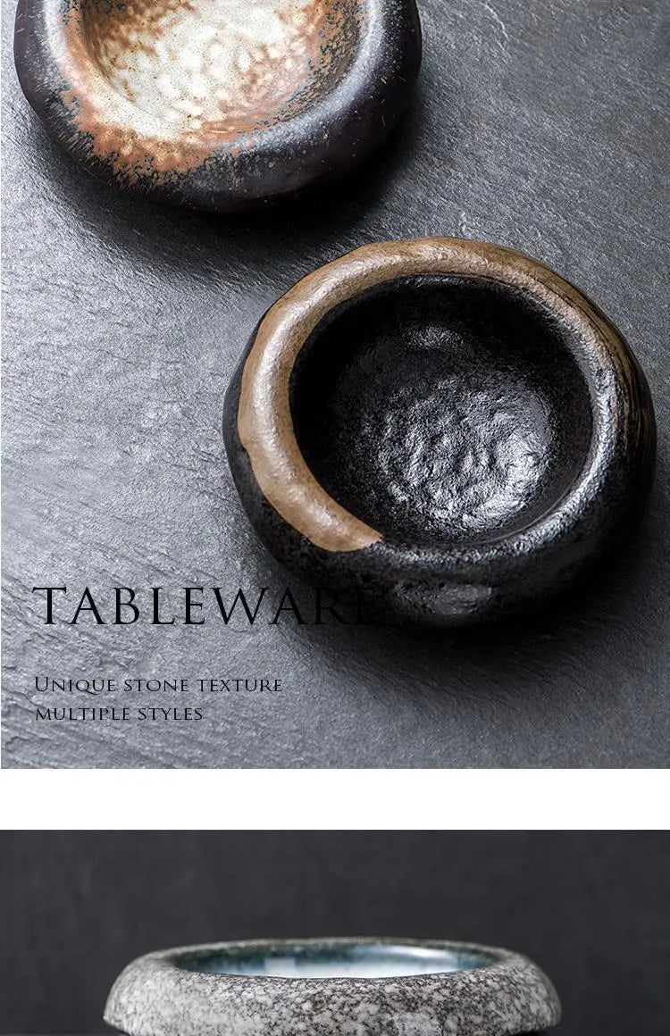 Ceramic sashimi bowl and retro speckled hat plate set in black ceramic with a rustic stone-like texture and earthy brown glaze accents.
