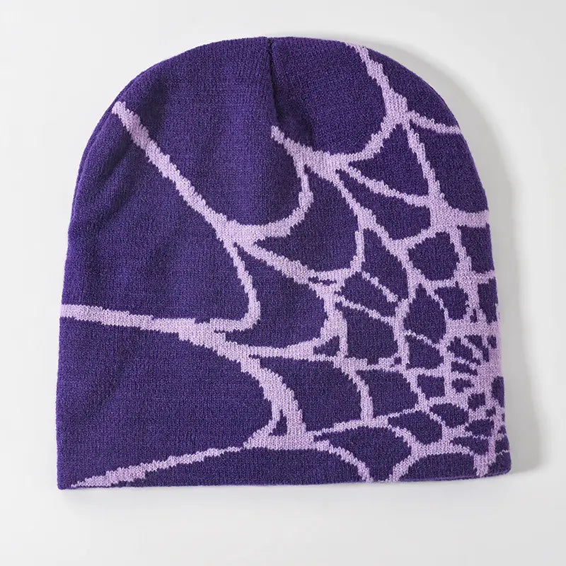 Purple knit beanie with a light purple spiderweb pattern designed as a winter hat.