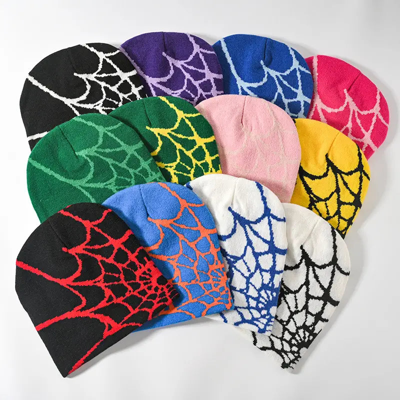 Colorful knit spiderweb knit beanie winter hats featuring bold contrasting spiderweb patterns in various hues.