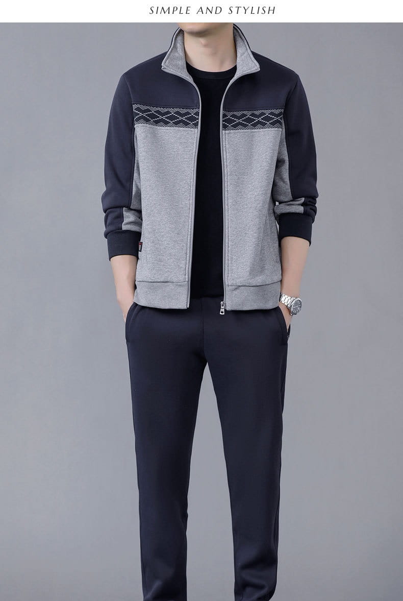 A stylish men’s geometric tracksuit spring casual athletic set featuring a two-tone zip-up jacket in navy and heather gray with a geometric patterned panel across the chest.