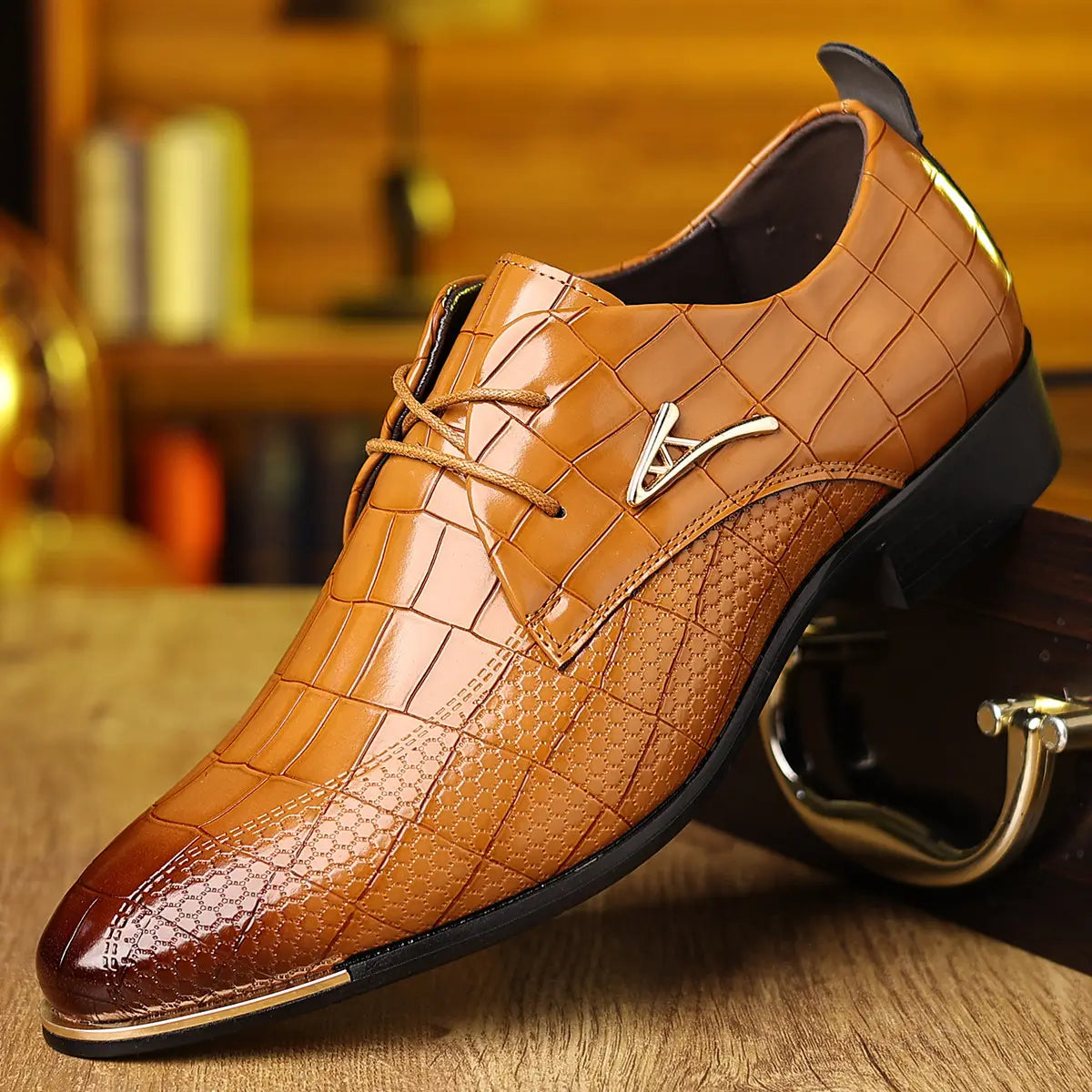 Men’s pointed toe formal leather business shoes in brown crocodile pattern with metallic toe cap and silver logo accent