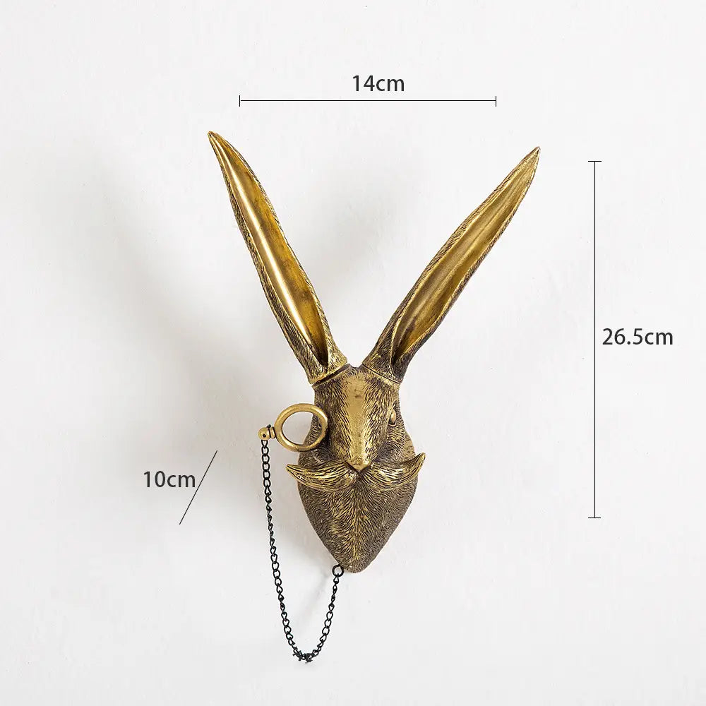 Antique brass resin rabbit head wall decor with long pointed ears and a chain attached to its mouth from the animal head wall decor brass resin figurines with glasses collection.