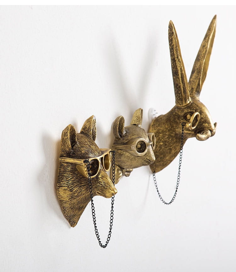 Gold-toned brass resin animal head wall decor featuring a fox mouse and rabbit with glasses and chain accessories.