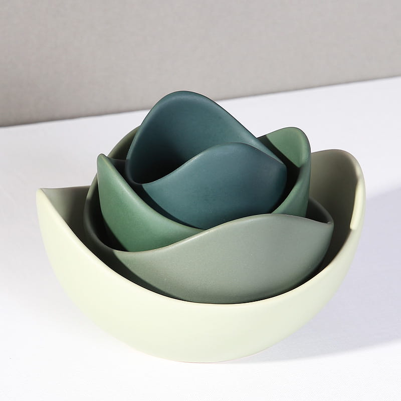 Set of nested ceramic bowls in gradient green shades designed to resemble a blooming flower from the ceramic lotus bowl pastel pink nesting flower set.