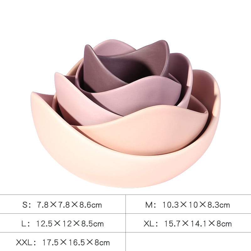 a set of four nested ceramic bowls shaped like a lotus flower in soft pastel pink shades ranging from blush to mauve in the ceramic lotus bowl pastel pink nesting flower set