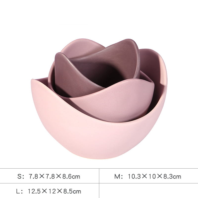 Set of three nested ceramic lotus bowls in pastel pink featuring a delicate rose shape with soft pink and mauve hues and a smooth glossy finish.